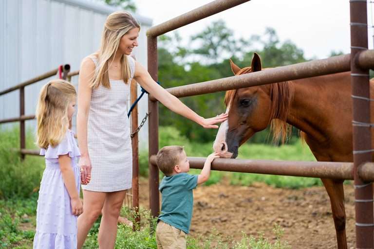 Lifestyle, family photography at a local farm near Austin, Texas with horses.